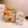Gift set featuring a glass scented candle with cream wax, cereal rings and a yellow gift box - Cereal Loops