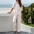 Women's two-piece white short sleeve shirt and pants set with golden graphic prints - S / Apricot