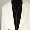 Minimalist gold titanium Y-necklace with geometric rectangle links worn by a model - Gold (M035)