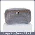 Large grey mesh makeup bag featuring a playful eyes embroidery and zipper closure - Large / Gray