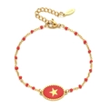 Detail view of gold beaded bracelet with red charms and star pendant in stainless steel - Red (XN138-red)