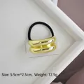 Close-up of gold U-shaped double-layered hair tie with size 5.5cm x 2.5cm and 17.5g weight - Gold Glossy Double Ring