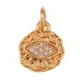 Macro shot of gold eye pendant with sparkling clear crystals and textured metal finish - Evil Eye