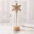 Golden iron snowflake desk ornament on round wooden base for modern home decor - Snowflake-Gold