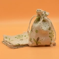 Beige drawstring linen pouch with green floral butterfly print for gifts or sachets - Dandelion