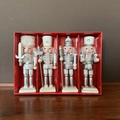 Detail of silver walnut cracker soldier figurines set with red festive gift box - Silver and White Nutcracker 4-Piece Set
