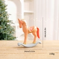 Nordic rocking horse Christmas ornament in light brown with festive red reins - Pink Rocking Horse
