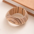 Macro detail of wide wooden bangle showing natural grain texture and polished surface - L413-2 Wood Color Striped 3D