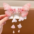 Detailed close-up of pink butterfly hair clips with floral resin accents and long tassels - Best Seller / Pink Butterfly Style (X10)