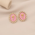 Detail of vintage pink enamel oval stud earrings with gold rose and pearl border - Pink