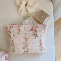 Detail of pink floral cotton cosmetic bag with simple wish label and soft makeup accessories - Gentle Pink Floral