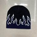 Navy blue and black knit beanie featuring white flame jacquard pattern in street style - One Size / Navy Blue