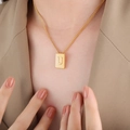 Minimalist gold necklace with rectangular block pendant featuring an engraved letter U - Letter U Style (P1506-U)