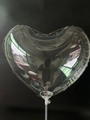 Detail of heart-shaped transparent PVC balloon with LED light string on a white pole - Heart Shape / Clear