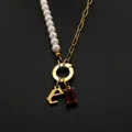 Elegant stainless steel necklace with pearl chain, letter E pendant and red gemstone - Gothic Letter E