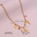 Gold stainless steel necklace with pink heart, cherry, and skull charms on pink base - Skull Cherry Wings Pendant Style (3#)
