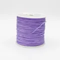Detailed close-up of 0.8mm purple braided cord wrapped on a spool for jewelry making - Color 672 Light Purple