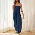 Detail of navy blue wide-leg jumpsuit with thin straps and side pockets on model - S / Navy Blue