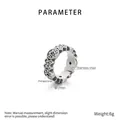 Detailed view of vintage stainless steel XO ring with crystal stones on white background - US 6 / Vintage Silver (KR103670-K)