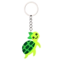 Cute green PVC turtle keychain with a dark green bow and spotted shell pattern - Turtle