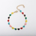 Detailed close-up of 18k gold plated bracelet featuring colorful enamel heart charms - Colorful 1