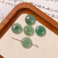 Five round green jade beads with natural texture on sand background for DIY jewelry - Green Round Natural Stone Style (029号)