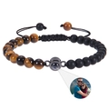 Macro view of projection stone bead showing custom portrait photo on woven bracelet - Tiger Eye + Matte Stone