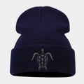 Detailed close-up of navy blue knit beanie featuring high-quality turtle embroidery design - Navy Blue