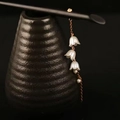 Elegant wooden hair stick with white lily of the valley floral pendant and gold chain - White Wind Chime Style