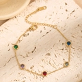 Elegante bracciale in acciaio al titanio dorato con cinque pietre preziose colorate su pietra - Bracciale di Zirconia Multicolore