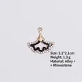 Detail of fan-shaped black enamel pendant with gold trim and white rhinestones - Style 5 Ginkgo Leaf / Gold