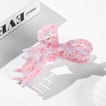 Pink and white marbled acetate bow hair claw clip for women with strong grip design - Pink Spotted