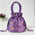 Elegant purple embroidered bucket bag with silk texture and floral patterns - Violet