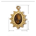 Macro view of oval sun pendant in stainless steel with tiger eye natural stone detail - YE493-1-Tiger Eye Sun