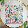 Square floral paper napkin with wildflower print displayed on a white lace plate - Colorful Wildflowers (1068)