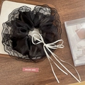 Elegant black lace scrunchie with white silk ribbon bow and floral tulle detail - Black