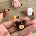 Close-up of cute 3D resin cookie bear hair clips with vibrant brown and pink tones - Dark Brown Bear