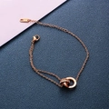 Elegant rose gold titanium steel interlocking double ring bracelet with crystals and numerals - Rose Gold