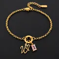 Elegant 14K gold plated stainless steel bracelet featuring pink stone and letter W charm - Letter W