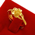 Golden flower shaped adjustable ring made of sand gold alloy on a red velvet stand - Hollow Flower Style (J2306)