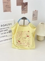 Detail of yellow embroidered tote bag with cherry prints and blue checkered handles - Star Yellow