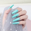 Close-up of long mint green coffin press-on nails with high-gloss UV finish - Mint Green (CBLL-29)
