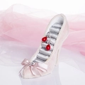 Pink high-heel jewelry display stand with silver satin interior and red teardrop earrings - Concubine Lotus Pink