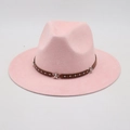 Pink wide brim fedora hat with star studded brown leather band on grey background - One Size / Pink