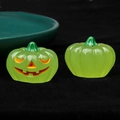 Detailed close-up of green luminous 3D pumpkin ornaments for Halloween DIY crafts - Luminous Green Pumpkin Orange Eyes / 3D