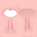 Handheld lip-shaped makeup mirror in pink finish with ergonomic handle and smooth plastic frame - 12*16 Pink