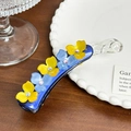 Dark blue acetate banana hair clip with yellow and light blue rhinestone floral accents - Blue