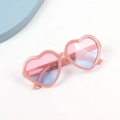 Close-up of kids heart sunglasses with pink glitter frames and gradient lenses - Nude Pink