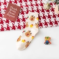 Cremeweiße Weihnachtsstrümpfe mit Rentier- und Glockenmuster aus gestrickter Baumwolle - Einheitsgröße / Beige