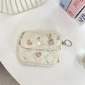 Detailed view of floral quilted pouch with bunny print, heart patterns, and keychain ring - Blue Dress Rabbit
